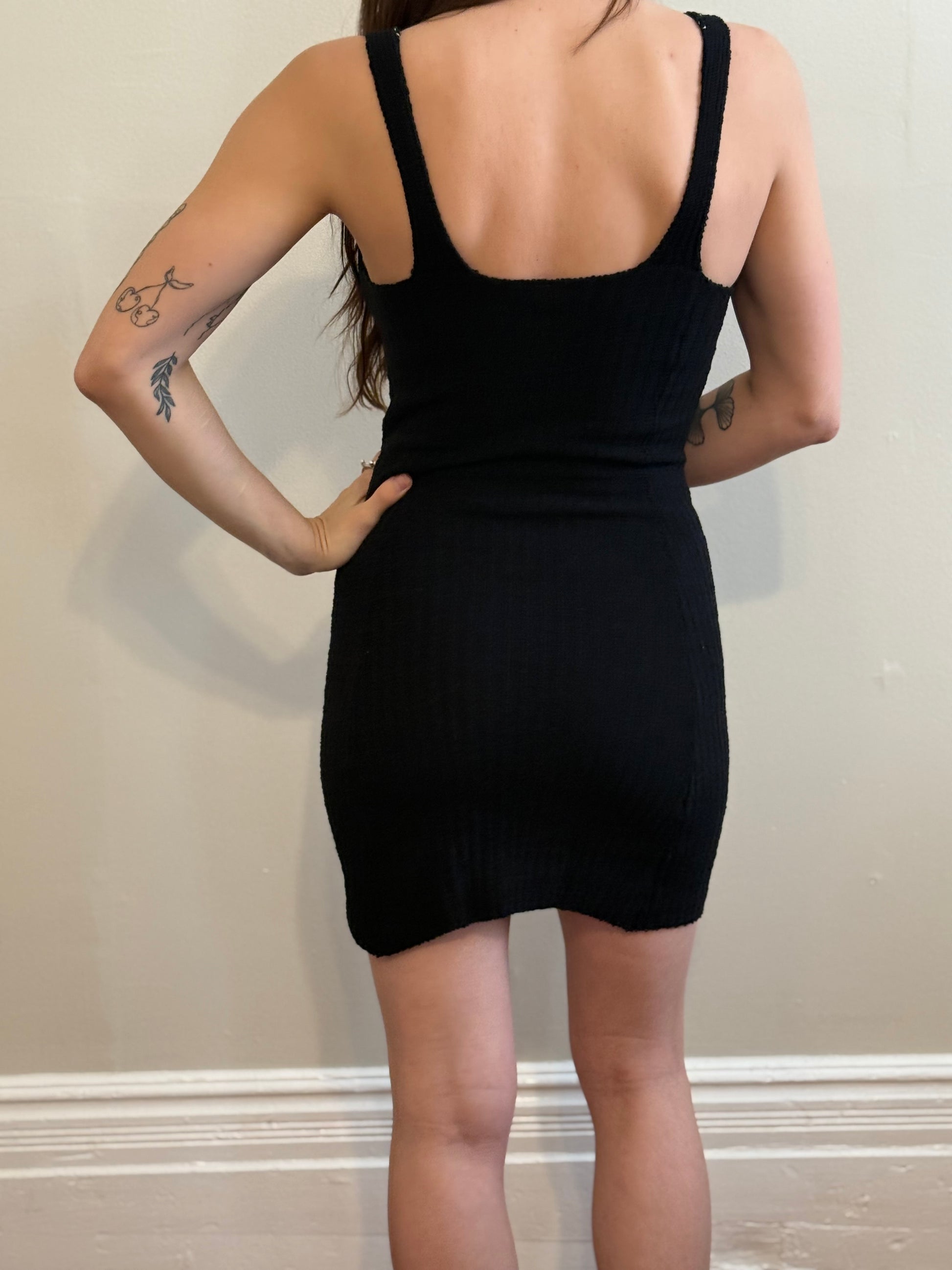 Black fitted knit dress from back