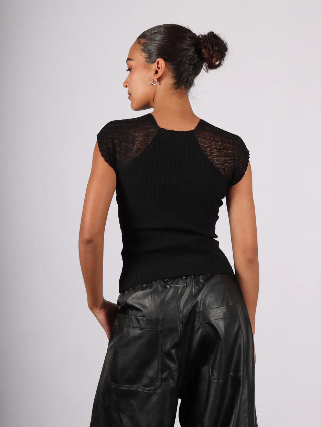 rib knit ralgan top in black with semi sheer sleeves